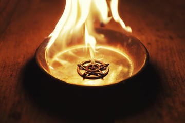 Old pentagram burning in flames