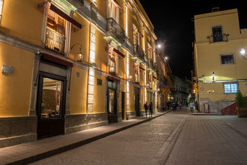 Fototapeta na wymiar Walking on the streets of Guanajuato City, at night. MEXICO