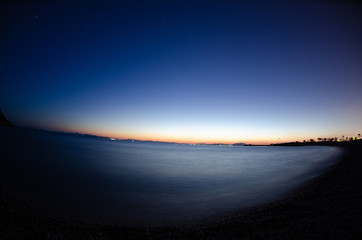 Fototapeta premium Afternoon Sunset, dark sky with stars