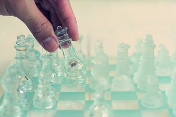 Chess board game made of glass, business competitive concept