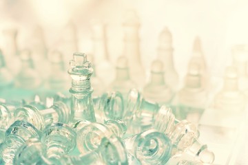 Chess board game made of glass, business competitive concept