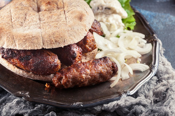 Cevapcici or cevapi served with lepinja bread