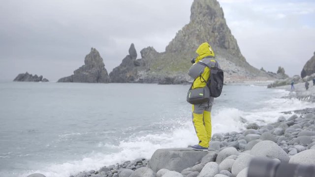Photographer Researcher on Antarctica Beach in Summer
