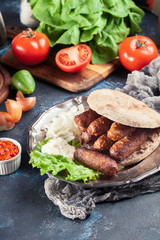 Cevapcici or cevapi served with lepinja bread