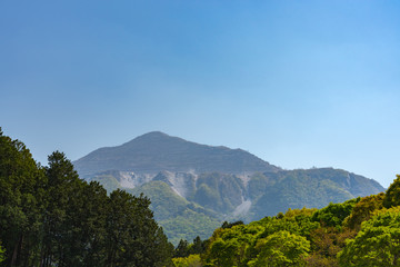 View of Mount Buko or Buko-zan, intensive mining left its scars on the mountain, in fact absolutely dominating the face of the mountain today. Chichibu city, Saitama Prefecture, Japan