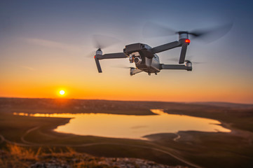 Fototapeta na wymiar Drone on sunset background