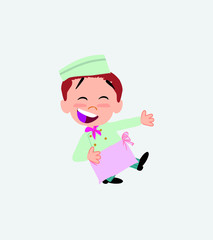 Chef laughing while teaching something to his left. 