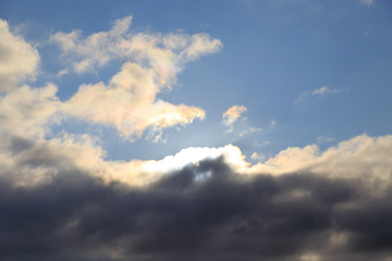 Fototapeta premium Clouds after rain before sunset as a background
