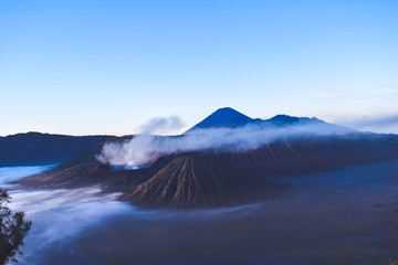 Beautiful colorful sunrise over Mount Bromo and wild island in Mount Bromo National Park