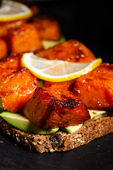 Toasted bread bruschetta with roasted  pumpkin and avocado.