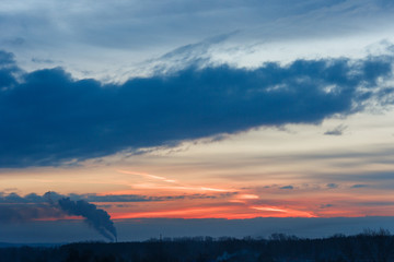 Beautiful winter dawn. Sunlight through the clouds in the morning in winter.