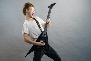 Man playing on electric guitar