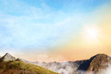 Fototapeta premium Panoramic views of top of the mountain with clouds fog