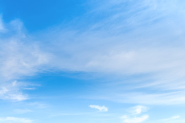 background of blue sky with white soft clouds