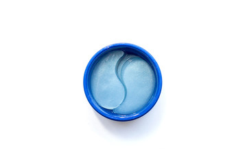 The concept of beauty, preservation of youth and self-care. Top view of a jar of blue hydrogel patches for eyes