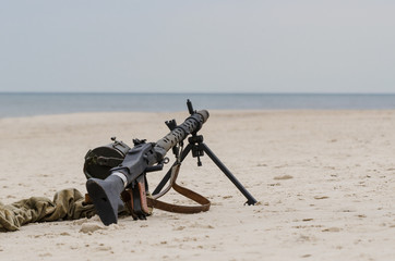 MACHINE GUN  - German military equipment from the Second World War on the sea beach