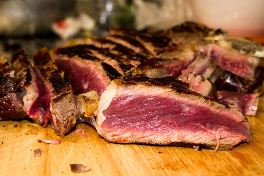 Florentine steak, t-bone steak on wooden cutting board