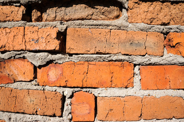 A fragment of an old brick wall.