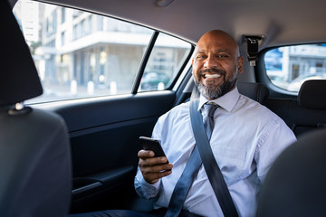 Successful black businessman in car