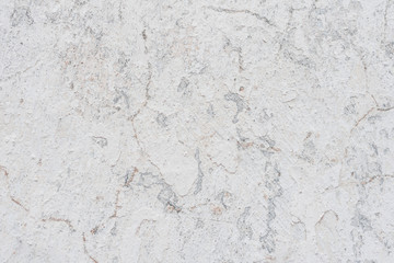 Wall fragment with scratches and cracks