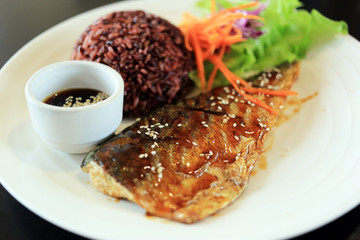 Grilled saba (mackerel) with rice berry and teriyaki dipping sauce. 