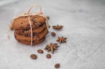 chocolate cookies with cinnamon and coffee on the table