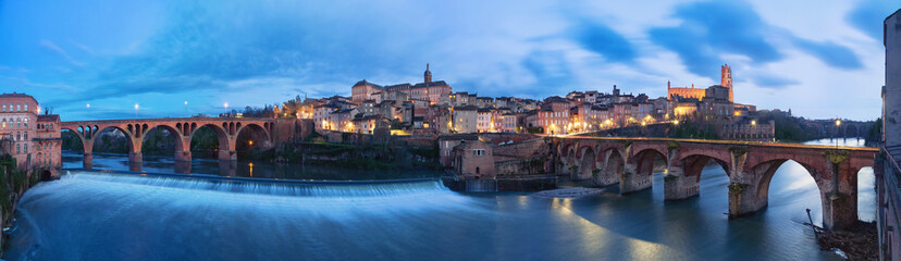 Albi, France. Panoramic cityscape at dusk made from bank of Tarn river  - obrazy, fototapety, plakaty