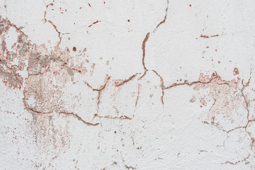 Wall fragment with scratches and cracks