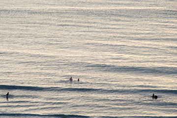 Aerial view of the seaside of the city of Santos in Brazil at sunset time when people walks in the beach relaxing and having fun