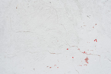 Wall fragment with scratches and cracks