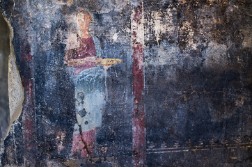 Figure of a woman painted in a Cool on black background in a Domus of Pompeii