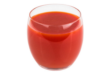 A glass of fresh tomato juice on a white isolated background