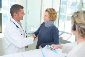 doctor handshake with a patient at hospitals lobby