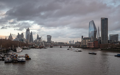 Fototapeta premium he London and River Thames skyline of skyscrapers in the financial district of The City of London plus The Shard and St. Paul's Cathedral landmarks.