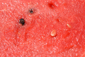 Red melon flesh, cut into sections With patterns and seeds Used as a background image.