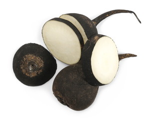 Black radish with slices isolated on white background, top view