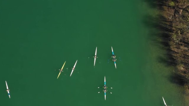 Croatia, Zagreb city, panoramic aerial view of Jarun lake from drone, overhead view, unrecognizable people paddling in kayak on beautiful green lake
