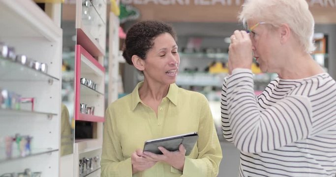 Customer ordering glasses at opticians