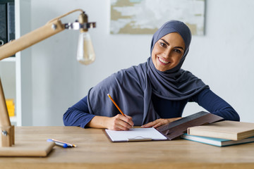 Gorgeous Muslim woman drawing