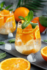 Fototapeta na wymiar Homemade refreshing drink with soda and orange juice