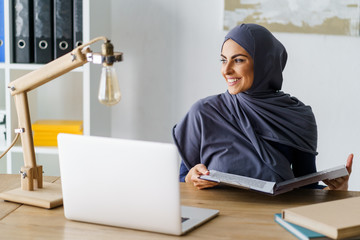 Beautiful Arabian woman working