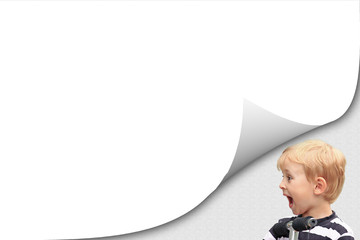 Blank white page with curl effect and surprised blond boy in the striped shirt on a scooter in an...