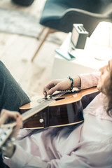 Attentive dark-haired musician having peaceful day off