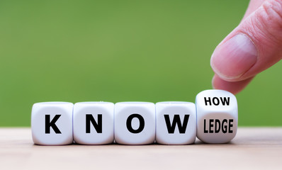 To have know-how or to have knowledge. Hand turns a dice and changes the word  "know-how" to "knowledge".