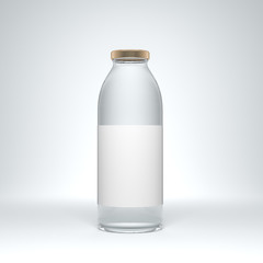 Big transparent glass bottle with label filled by still water on the white background.