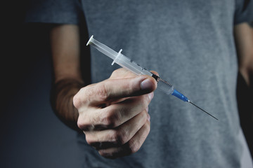 drug addict holding a syringe