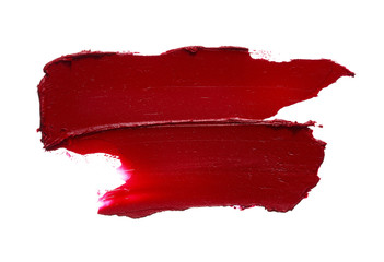 Red lipstick or acrylic paint isolated on white