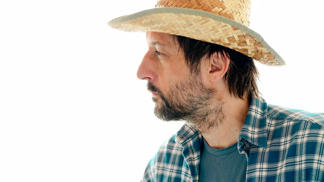 Portrait Of Thoughtful Farmer On White Background