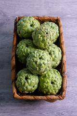 Freshly harvested artichokes in a basket, vegetables for a healthy diet.