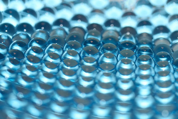 Water blue gel balls. Polymer gel. Silica gel. Balls of blue hydrogel. Crystal liquid ball with reflection. Texture background. Close up macro